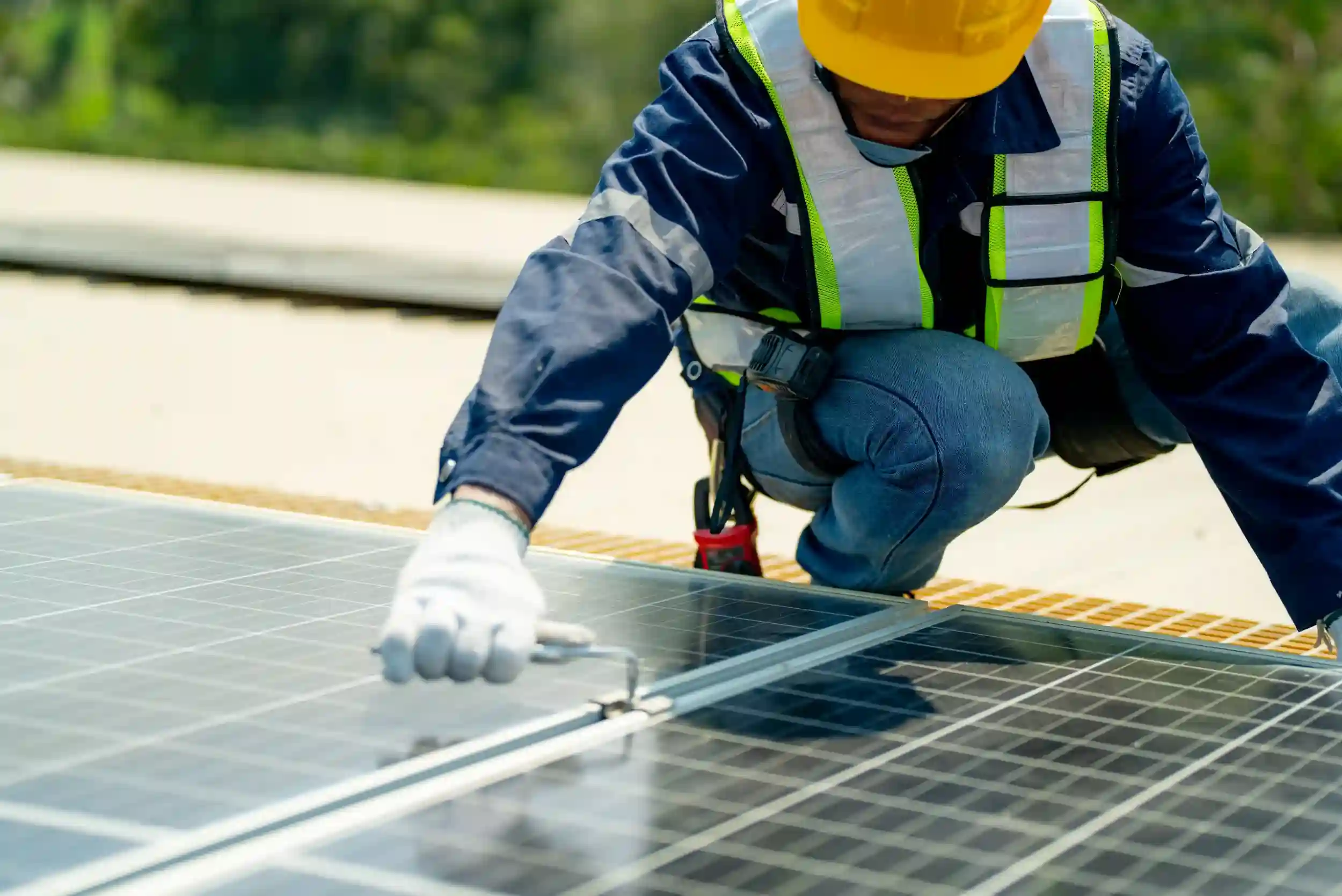 Technician from our Rockhampton solar team installing panels on-site.
