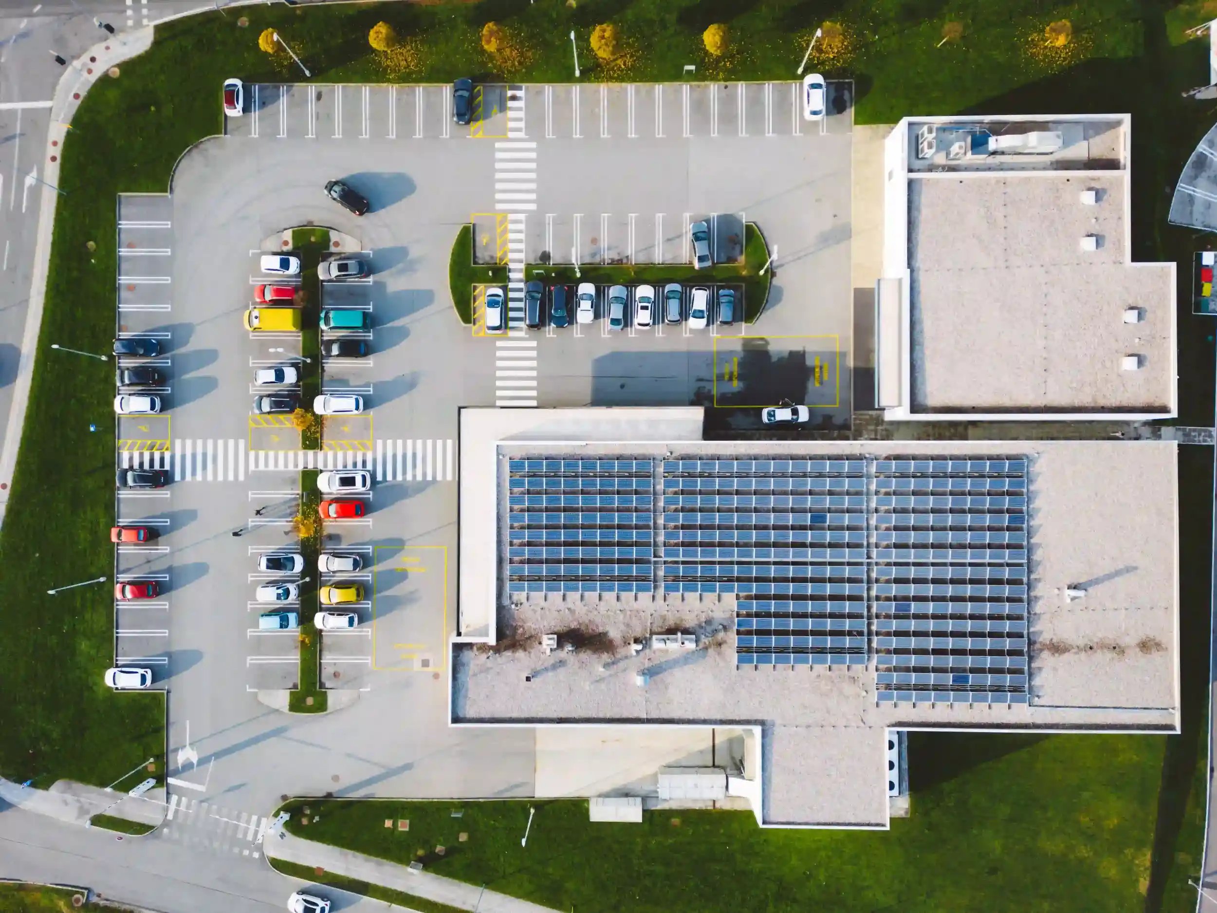 Aerial view of a commercial building in Rockhampton with a large rooftop solar system installed.