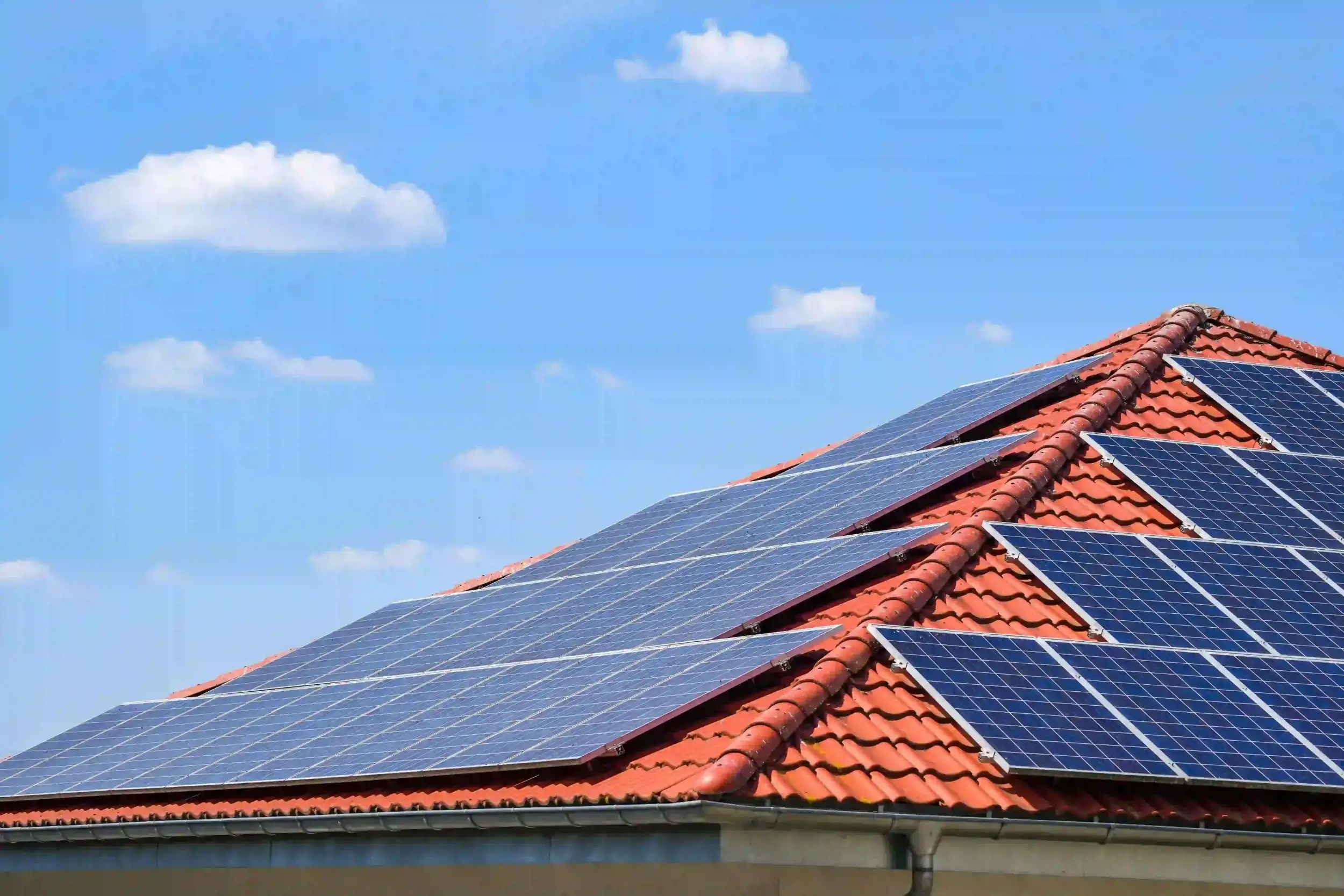 A Queensland home with a full rooftop solar system installed, showcasing eligibility for local solar rebates.