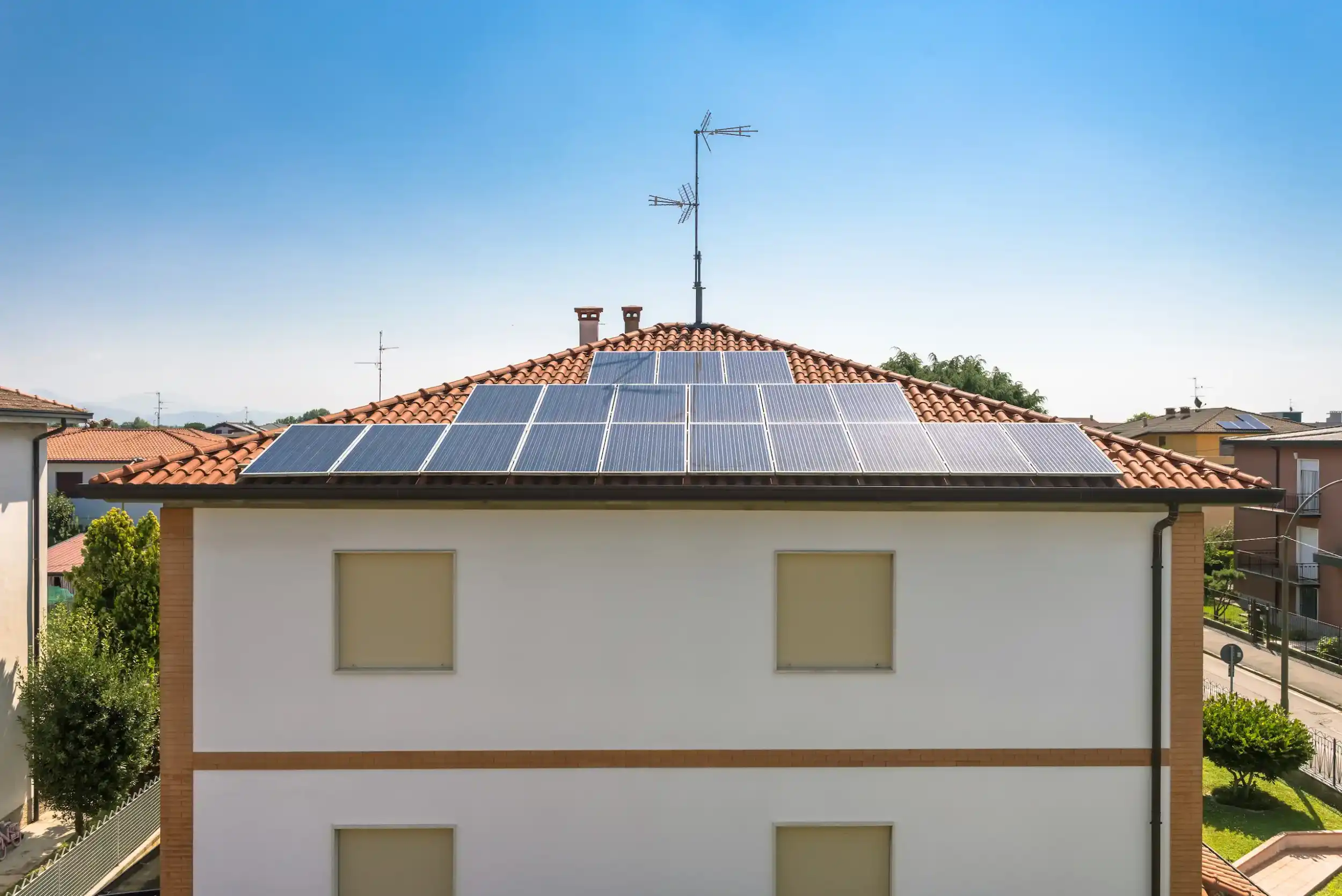 Residential home in Queensland with rooftop solar panels eligible for state rebates.