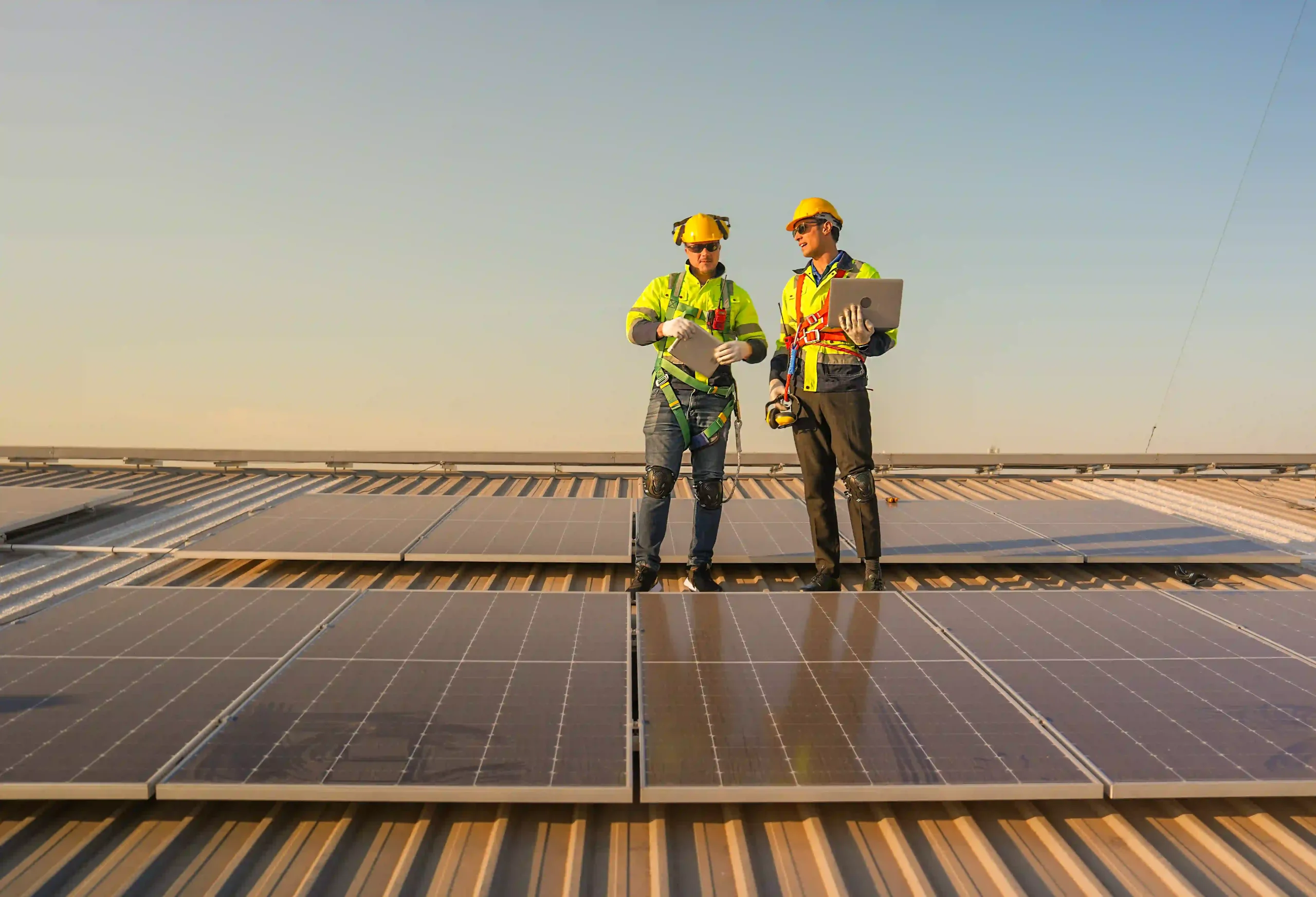Technicians inspecting solar panels during a Solar Panel Installation in Rockhampton.