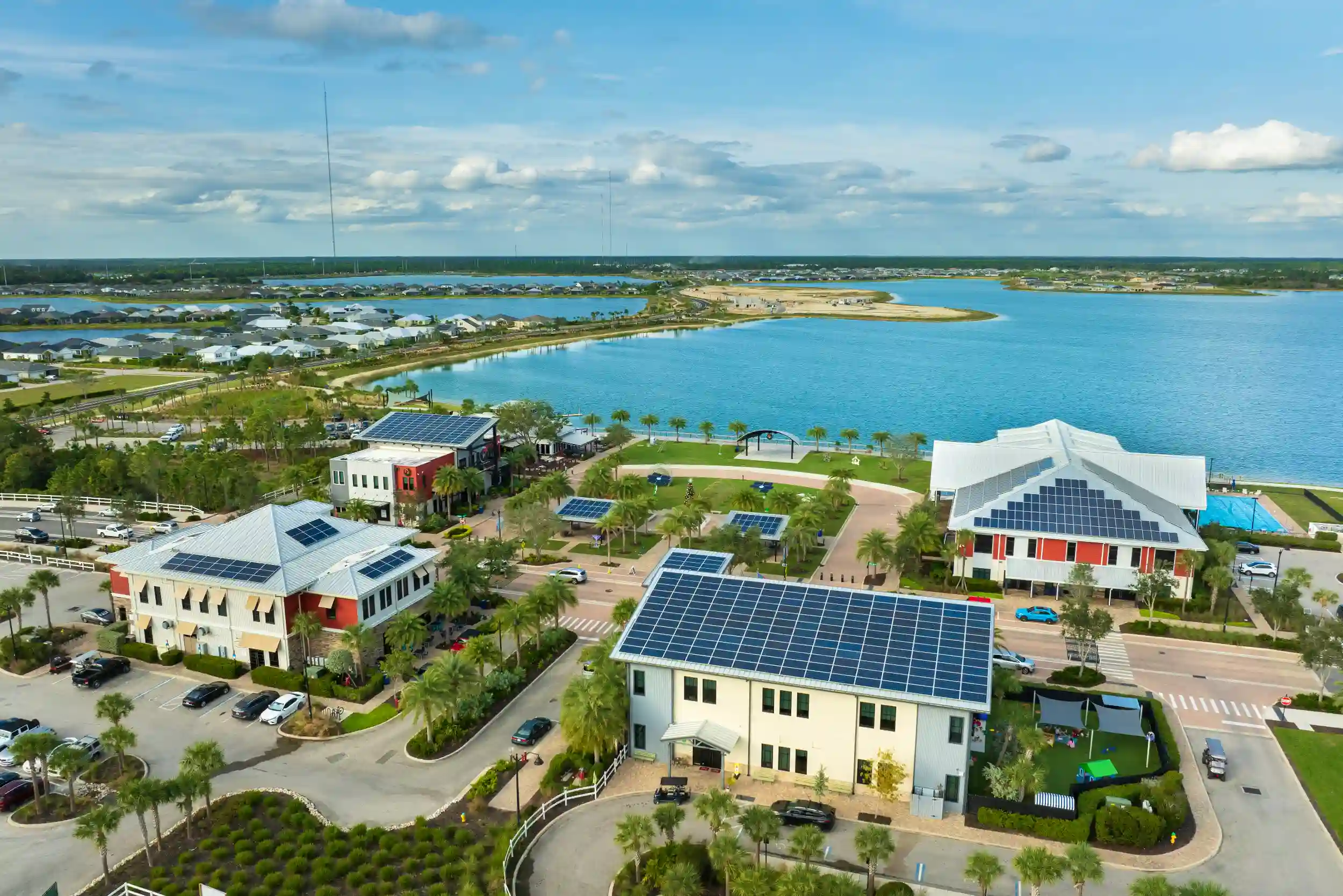 Solar panels installed on coastal buildings near the waterfront in Keppel Sands, generating clean renewable energy.