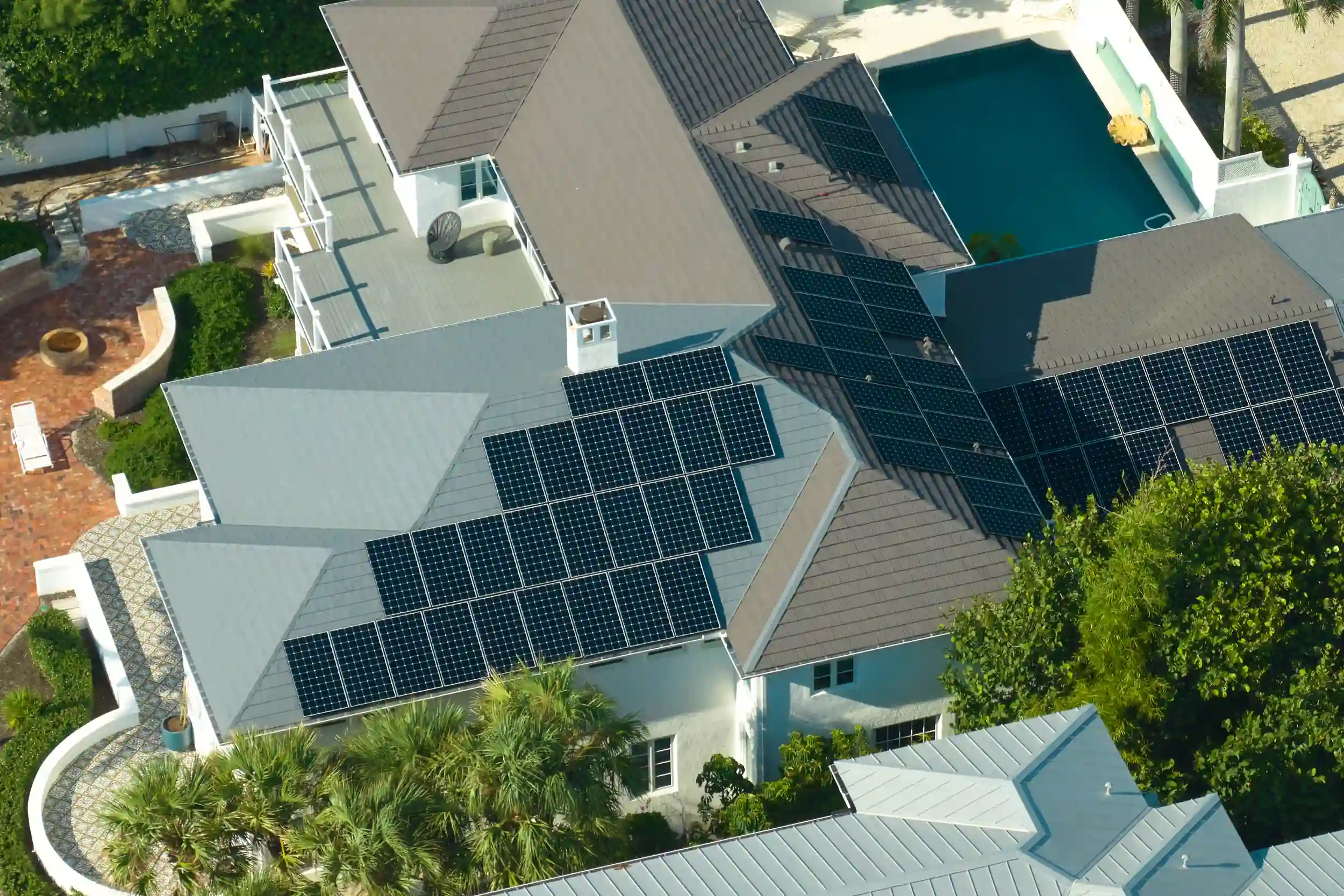 Aerial view of a residential home with rooftop solar panel installation in Rockhampton.